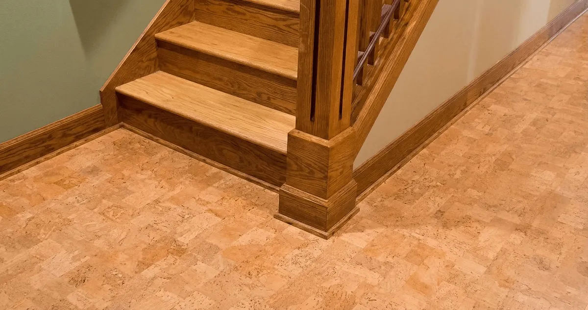 End of a staircase with cork flooring in Aurora, CO