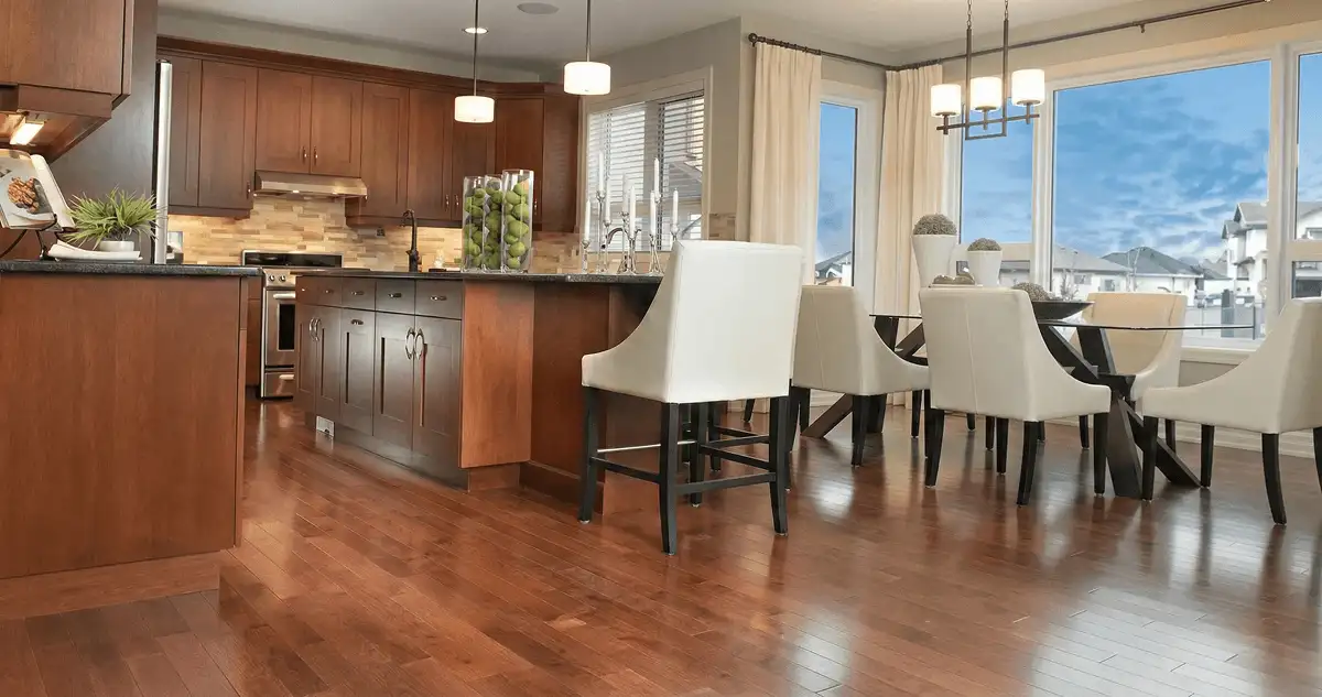 A modern kitchen with professionally installed wood flooring in Aurora, CO