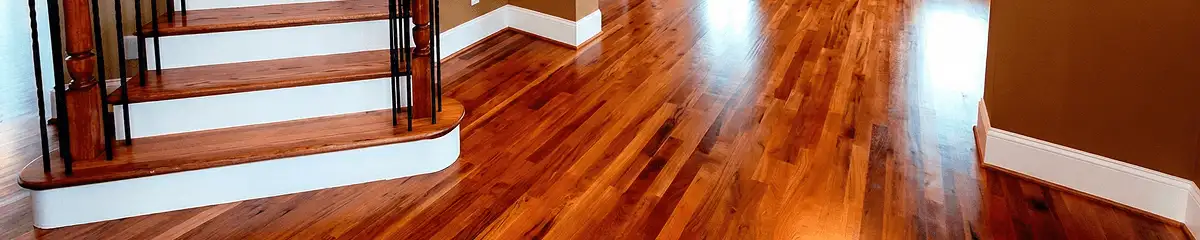Base floor of a staircase with professionally restored wood flooring in Aurora CO
