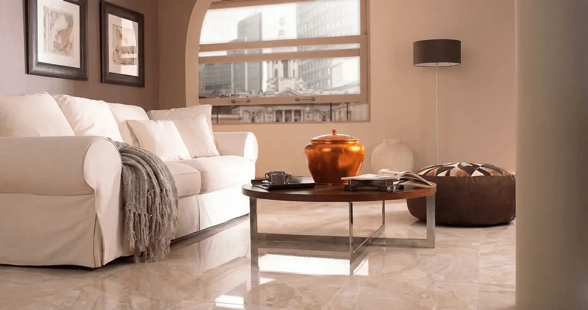 Modern living room with professionally installed marble flooring, a beige sofa, coffee table in Aurora, CO