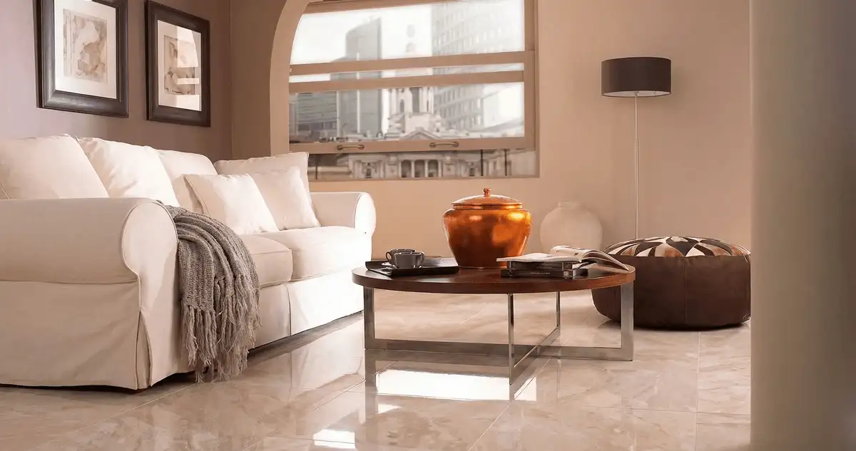 Modern living room with professionally installed marble flooring, a beige sofa, coffee table in Aurora, CO