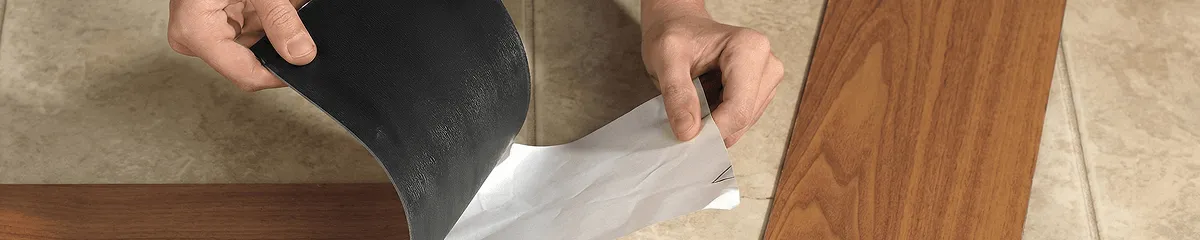 A professional installing vinyl flooring in Aurora, CO