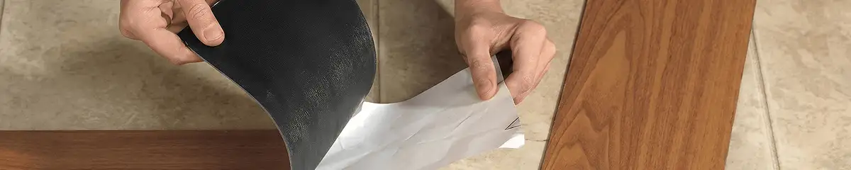 A professional installing vinyl flooring in Aurora, CO
